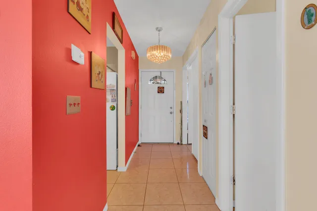 a kitchen with a refrigerator and a sink