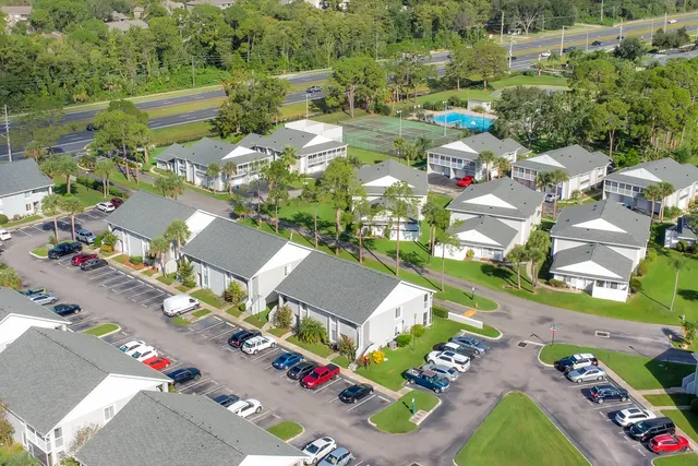 an aerial view of residential houses with outdoor space