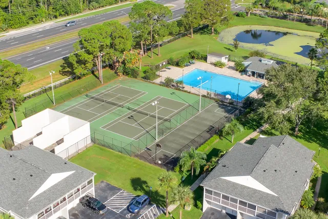 an aerial view of a house with a garden