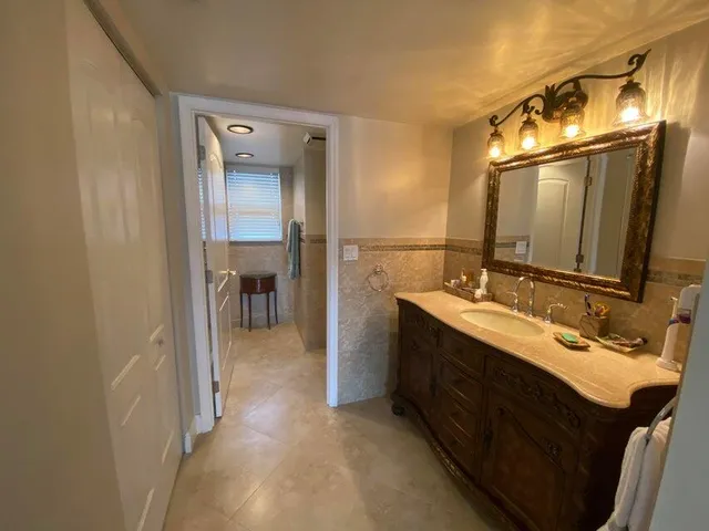 a bathroom with a sink and a mirror