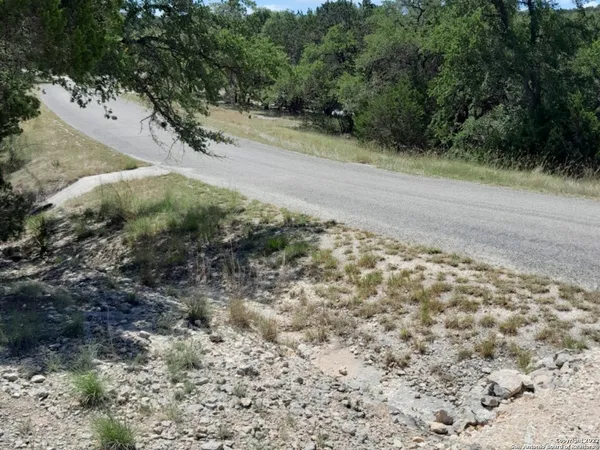 a view of a road with a yard