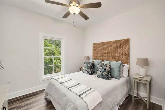 a bedroom with a bed and a window