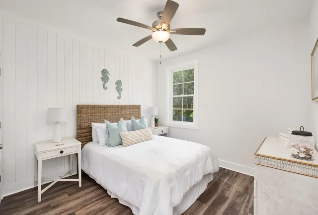 a bedroom with a bed and a dresser