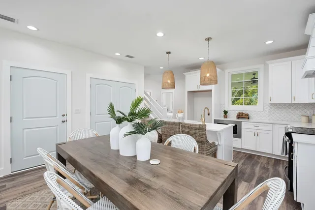 a kitchen with a table and chairs