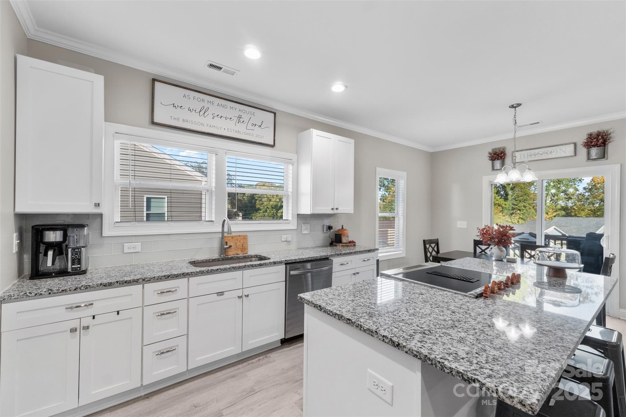1417 Azalea Avenue Kannapolis, NC 28081 - Photo 6 of 20 a kitchen with granite countertop a sink and white cabinets
