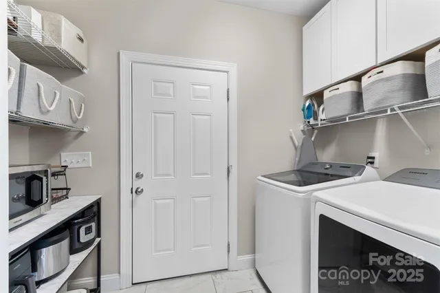 a kitchen with stainless steel appliances granite countertop a stove and a refrigerator