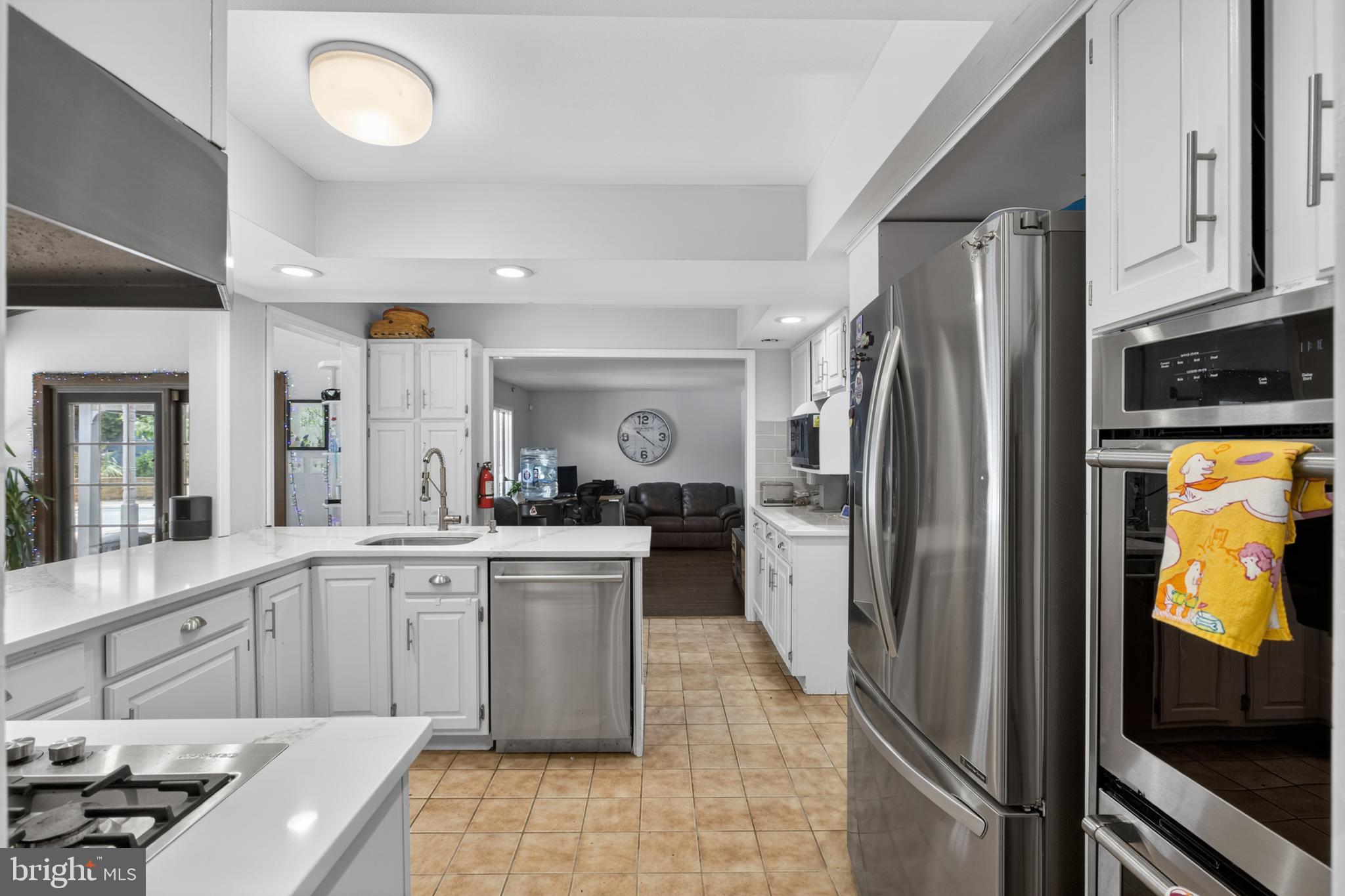 216 Revere Road Marlton, NJ 08053 - Photo 8 of 47 a kitchen with stainless steel appliances granite countertop a refrigerator and a stove