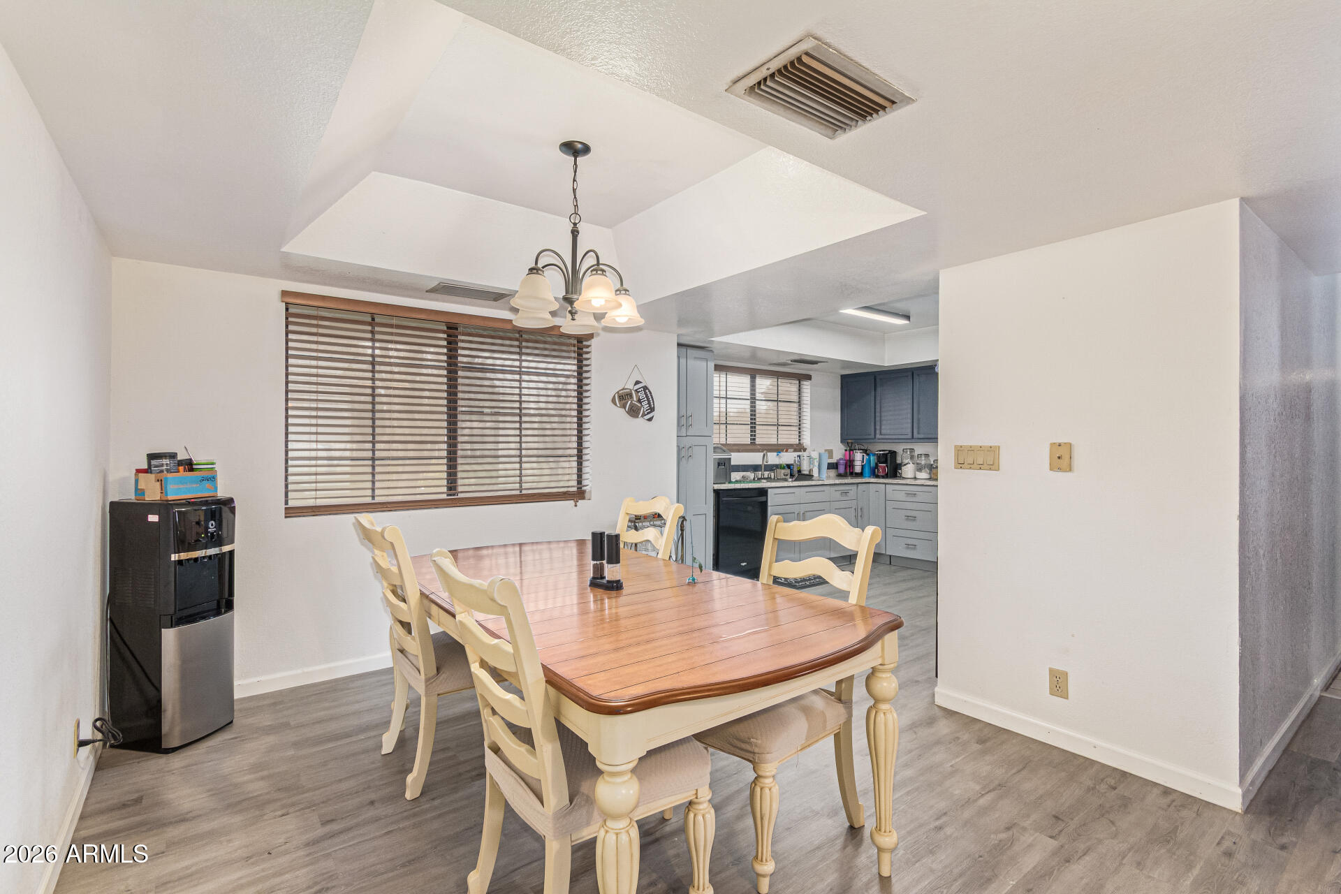 21613 South 154th Street Gilbert, AZ 85298 - Photo 11 of 57 a view of a dining room with furniture and wooden floor