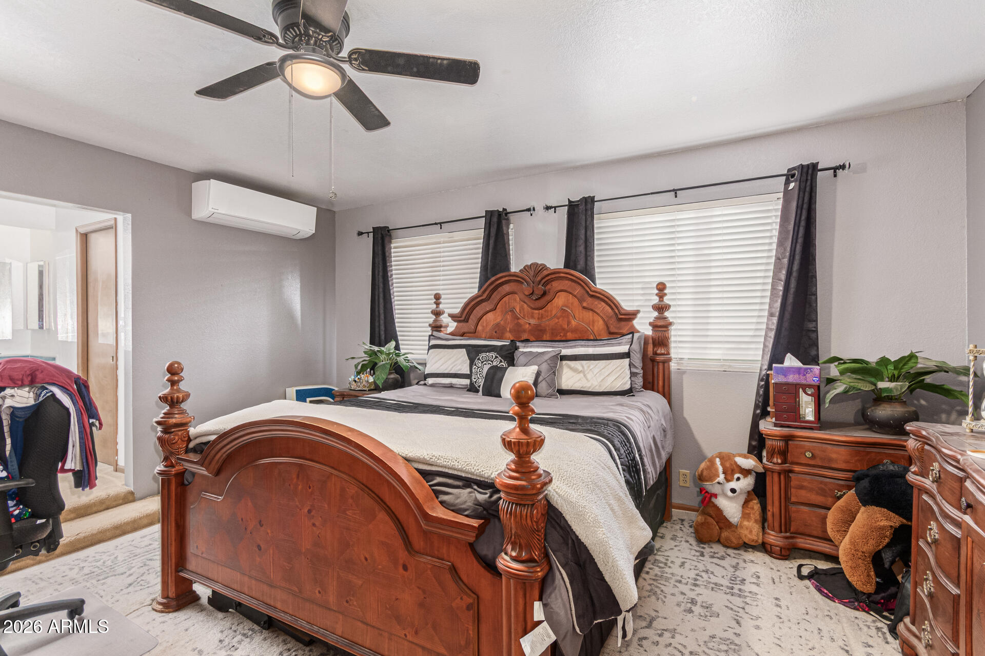 21613 South 154th Street Gilbert, AZ 85298 - Photo 18 of 57 a bedroom with a bed and a chandelier