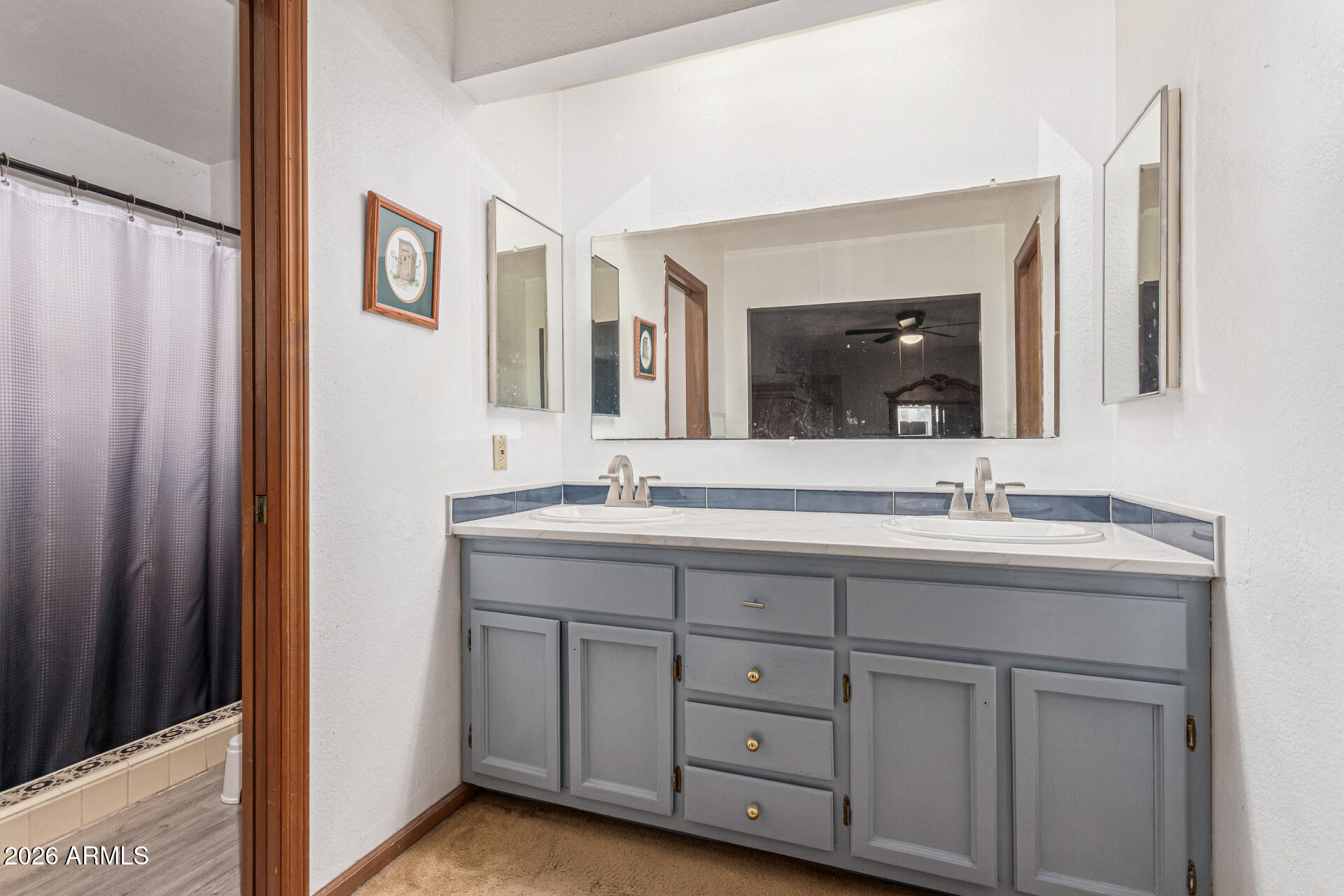 21613 South 154th Street Gilbert, AZ 85298 - Photo 20 of 57 a bathroom with a double vanity sink and a mirror