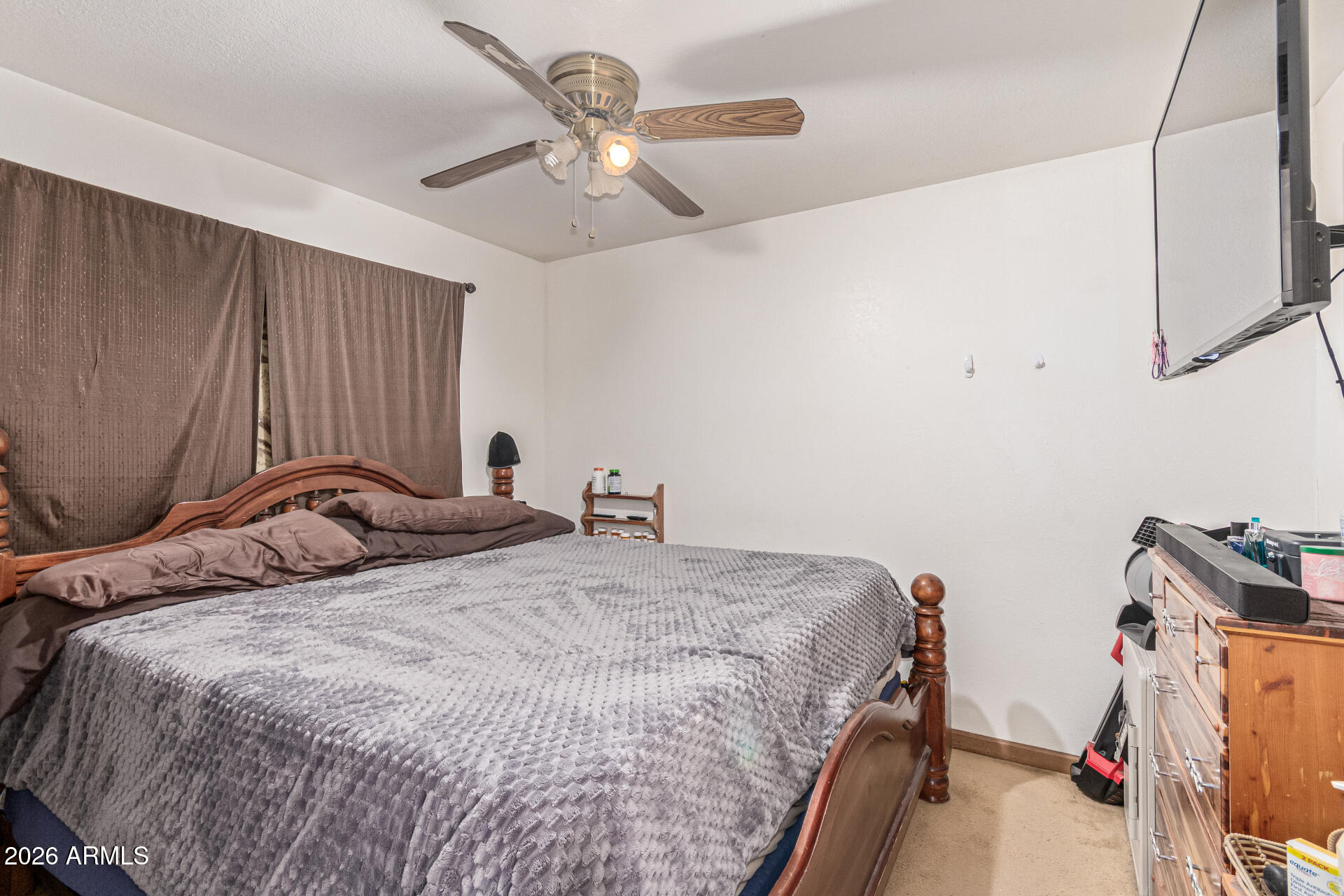 21613 South 154th Street Gilbert, AZ 85298 - Photo 22 of 57 a bedroom with a bed and a chandelier