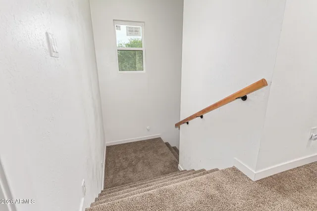 a kitchen with cabinets appliances a sink and a counter top space