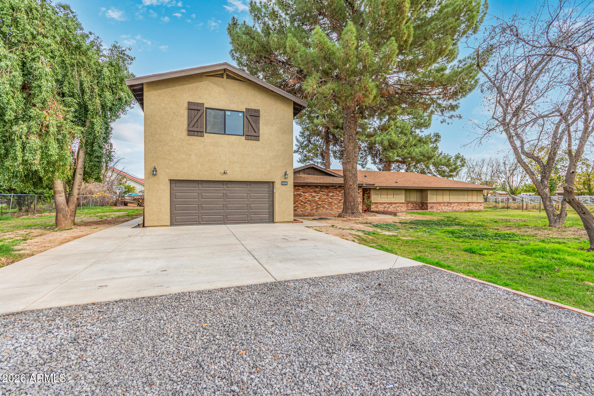 21613 South 154th Street Gilbert, AZ 85298 - Photo 3 of 57 a front view of a house with a yard and garage