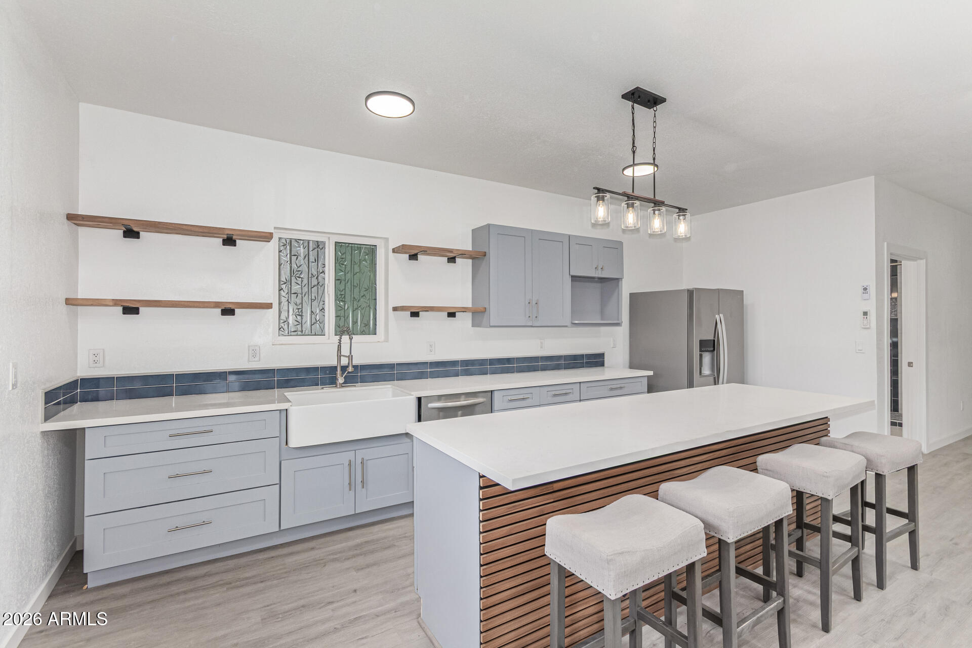 21613 South 154th Street Gilbert, AZ 85298 - Photo 32 of 57 a large kitchen with a table and chairs in it