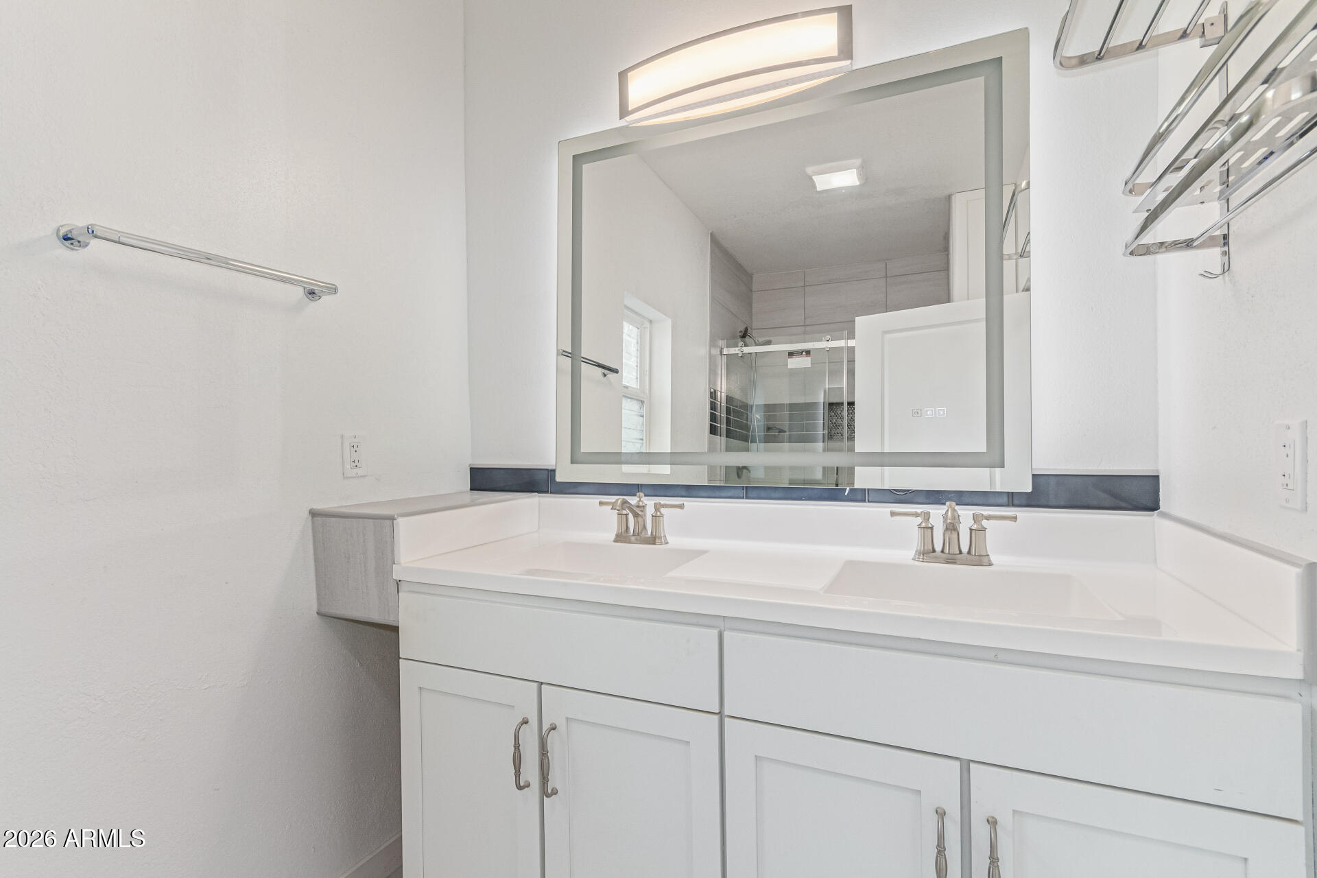 21613 South 154th Street Gilbert, AZ 85298 - Photo 39 of 57 a bathroom with a sink and a mirror
