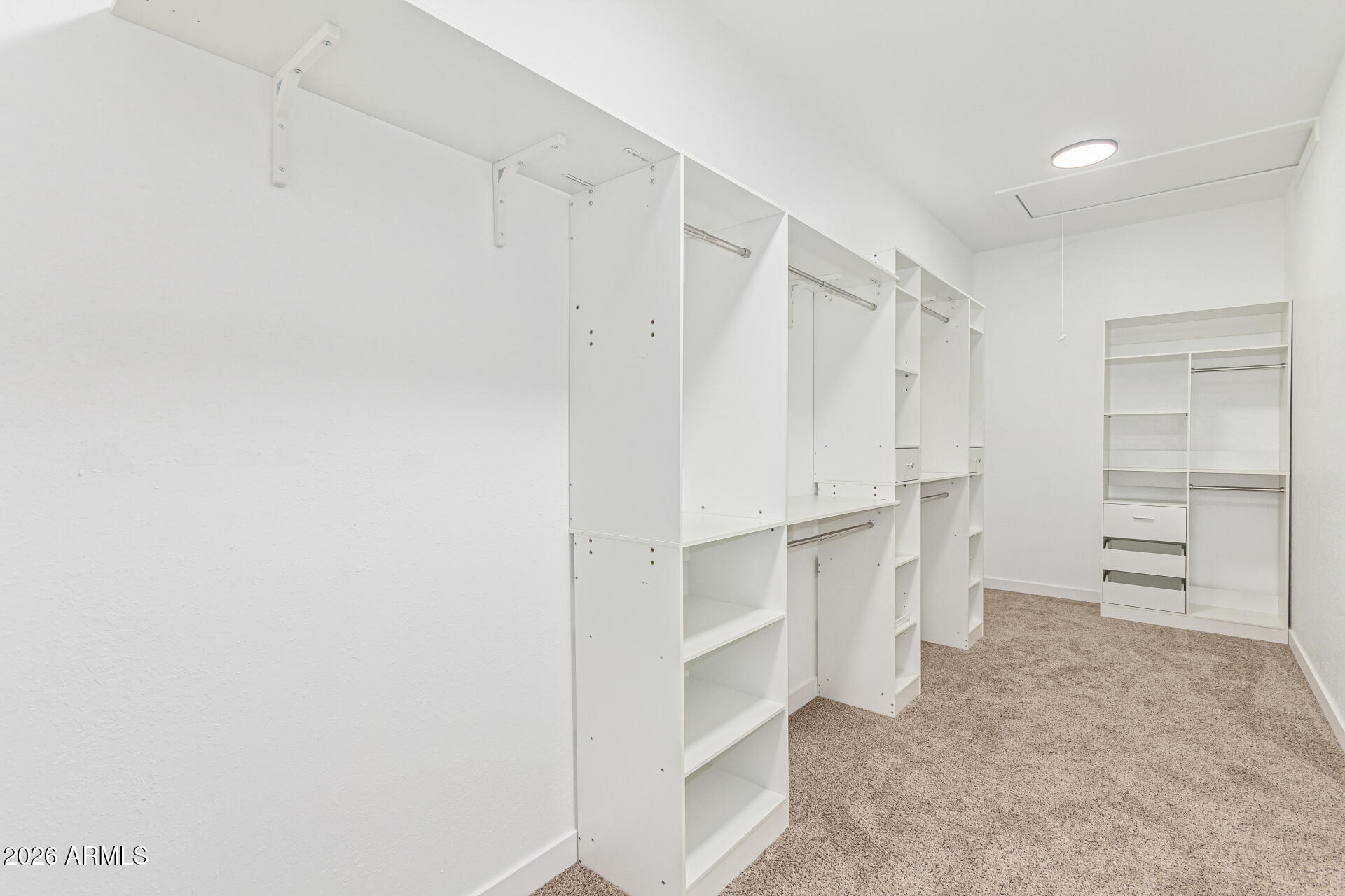 21613 South 154th Street Gilbert, AZ 85298 - Photo 41 of 57 a view of walk in closet with empty racks