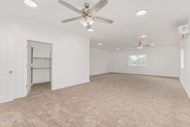 a view of a kitchen with a refrigerator and a window