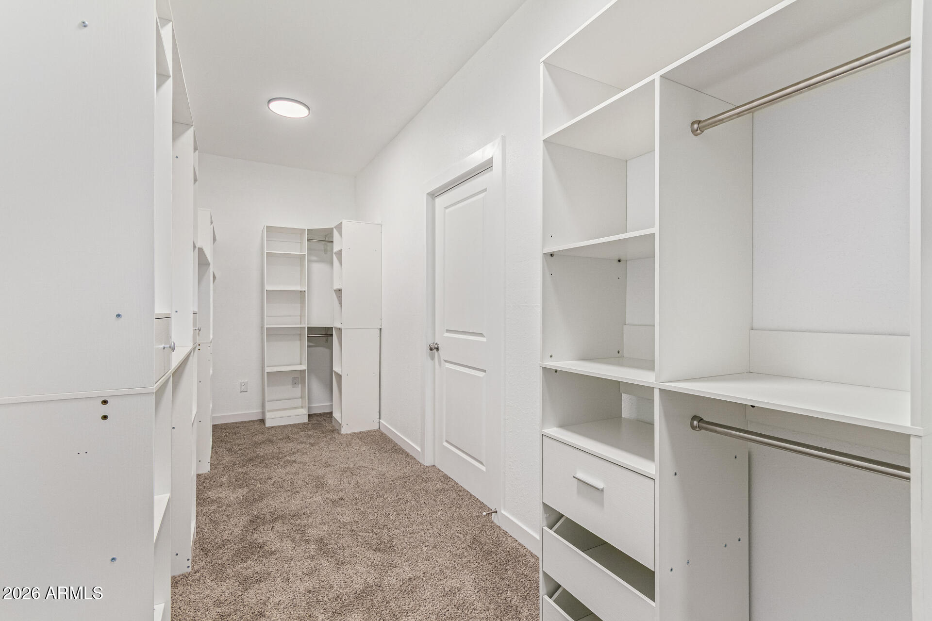 21613 South 154th Street Gilbert, AZ 85298 - Photo 44 of 57 a view of walk in closet with empty racks