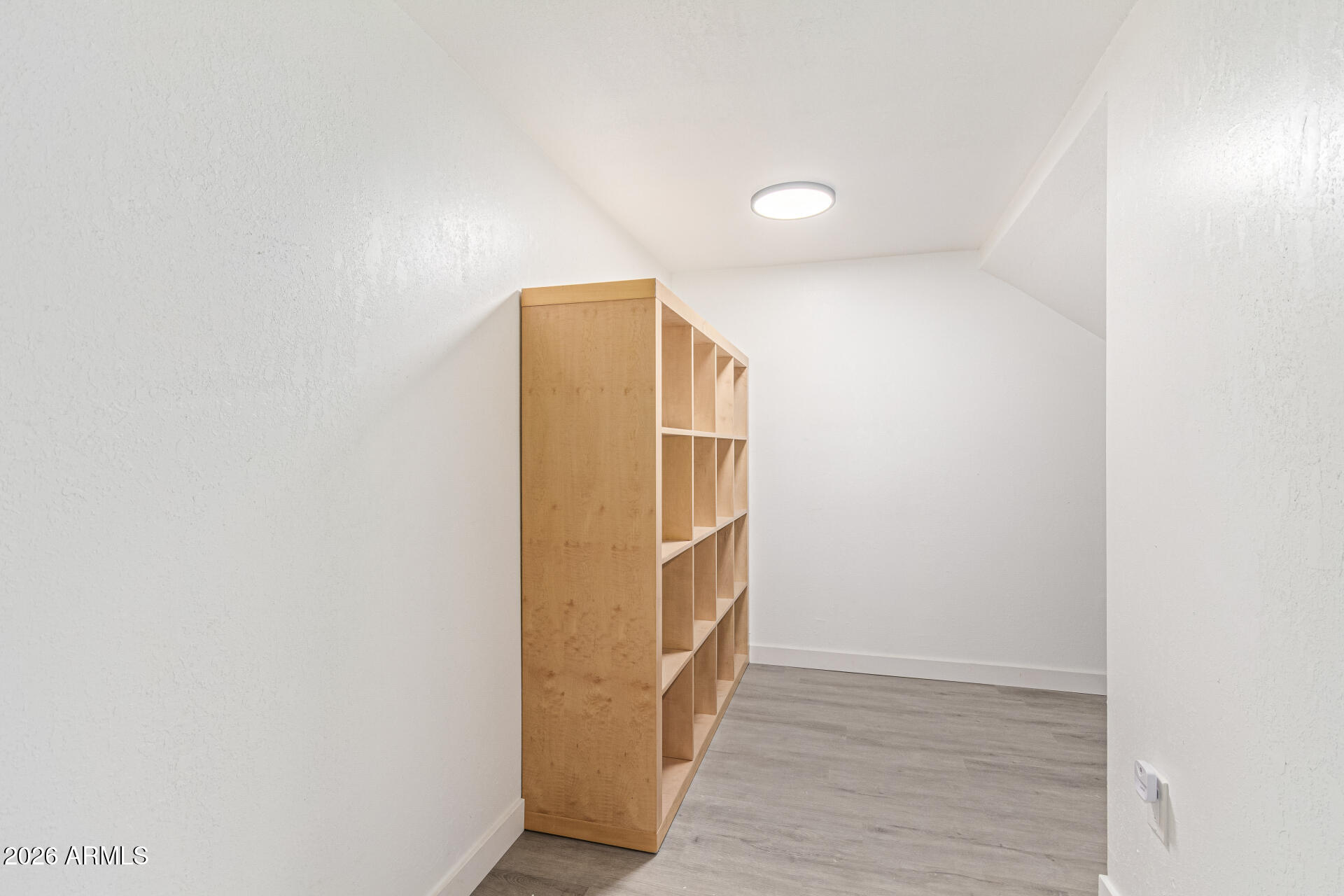 21613 South 154th Street Gilbert, AZ 85298 - Photo 45 of 57 a view of walk in closet with wooden floor
