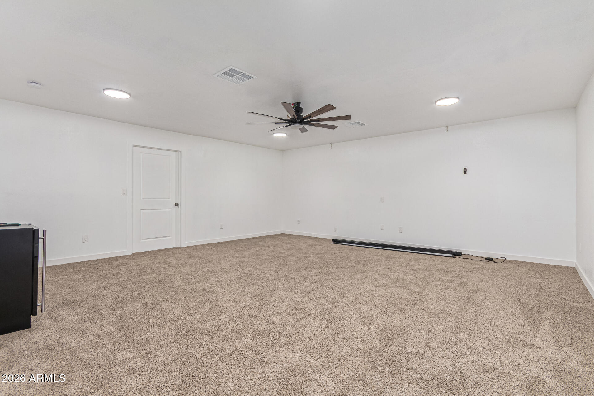 21613 South 154th Street Gilbert, AZ 85298 - Photo 46 of 57 an empty room with a ceiling fan and a window