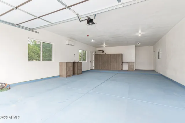 a view of a house with backyard and garden