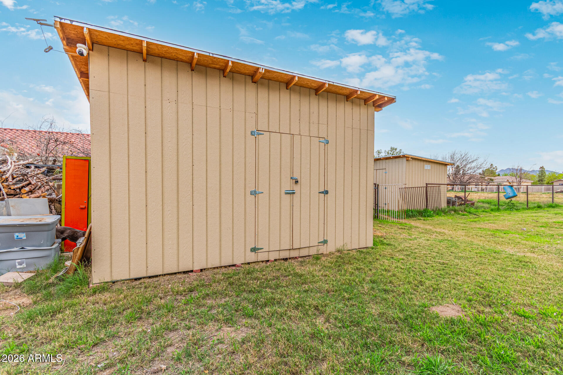 21613 South 154th Street Gilbert, AZ 85298 - Photo 53 of 57 a view of a backyard with potted plants and wooden fence