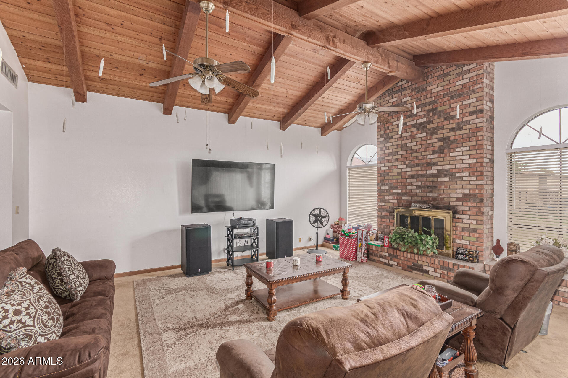 21613 South 154th Street Gilbert, AZ 85298 - Photo 7 of 57 a living room with furniture and a fireplace