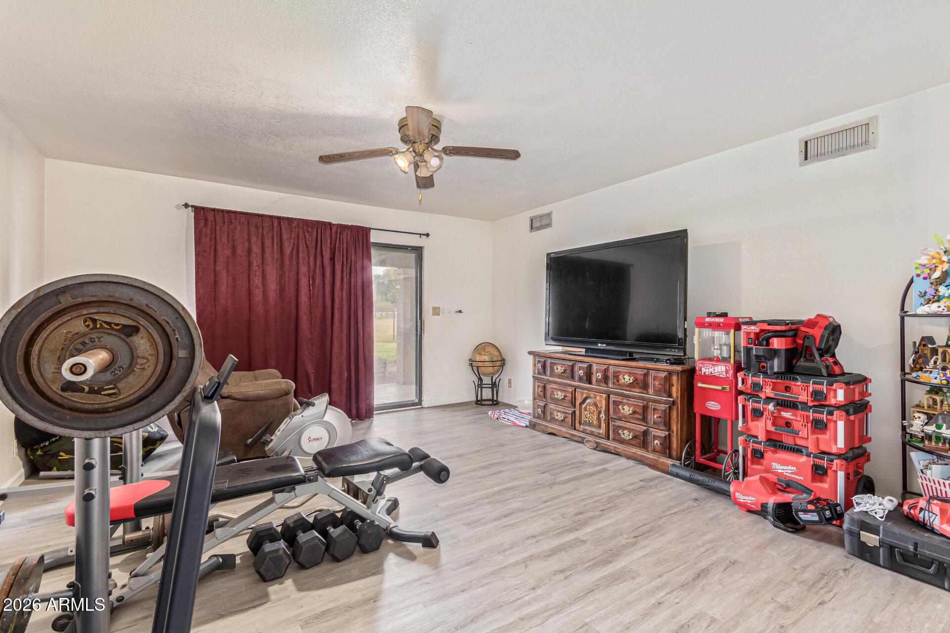 21613 South 154th Street Gilbert, AZ 85298 - Photo 10 of 57 a living room with furniture and a flat screen tv
