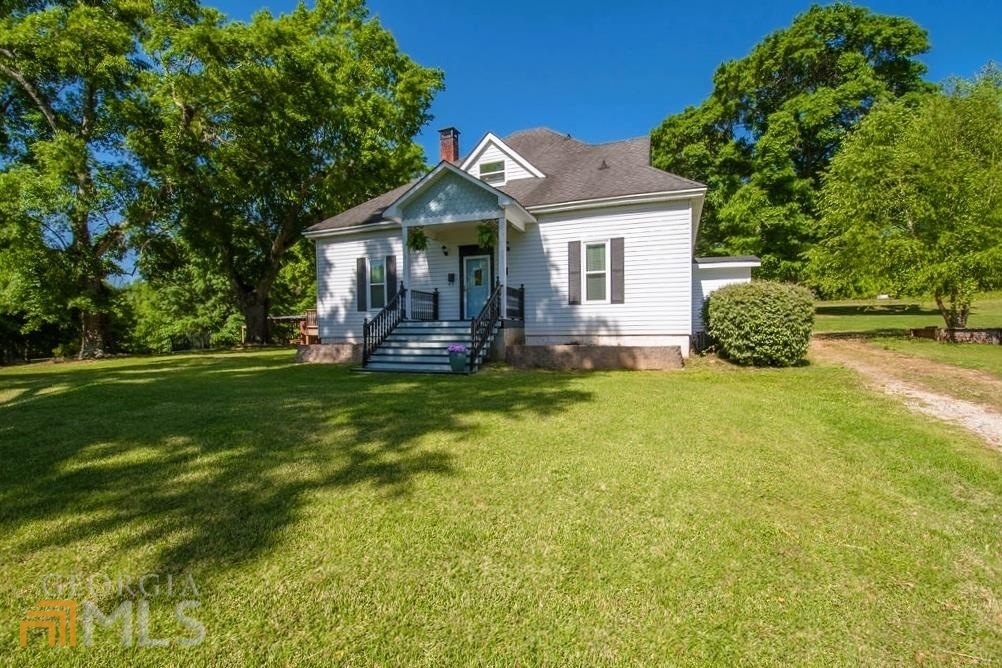 111 Inman Road Fayetteville, GA 30215 - Photo 1 of 1 a front view of a house with garden