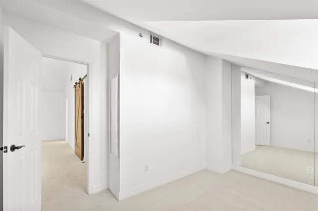 a view of hallway with closet