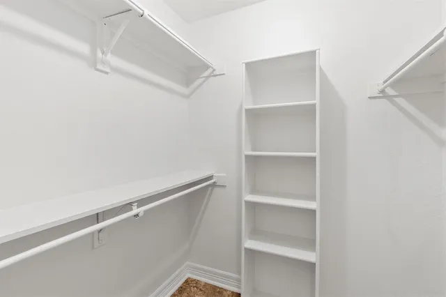 a view of an empty walk in closet