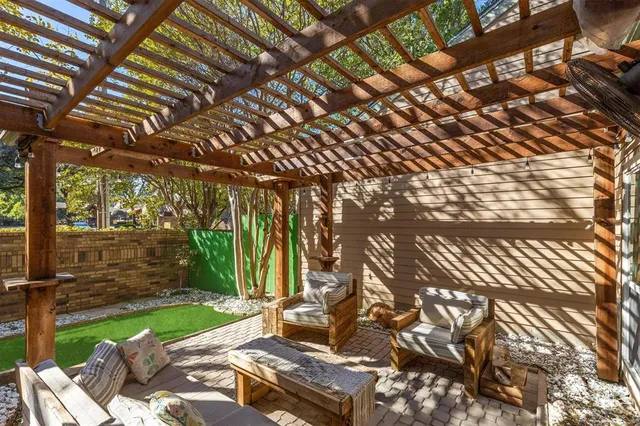 a view of backyard with a garden and outdoor seating