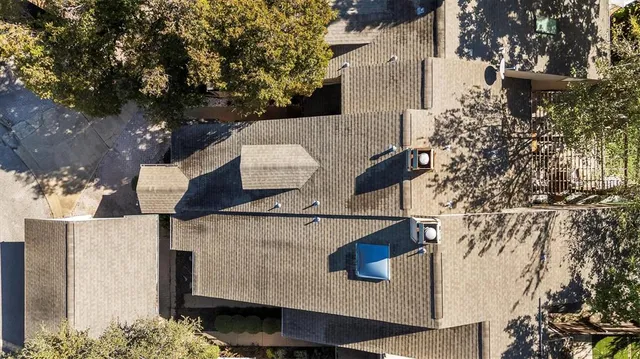 an aerial view of residential houses with outdoor space