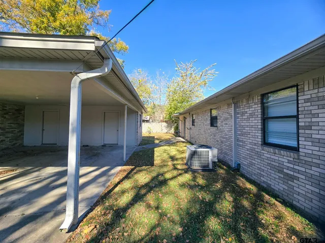a view of a backyard of the house