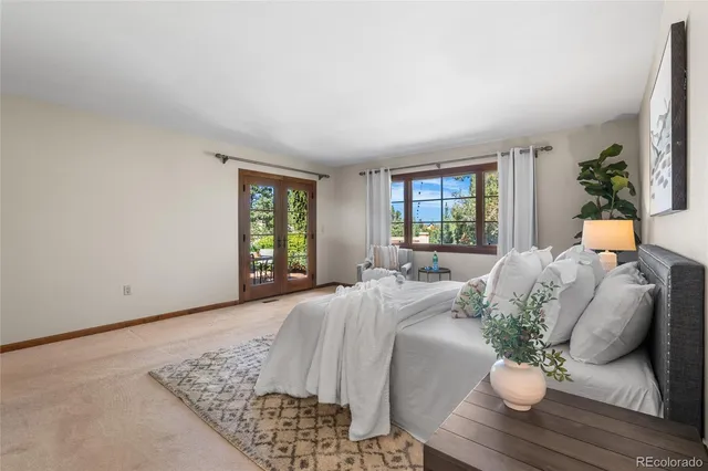 a bathroom with a granite countertop sink mirror and toilet
