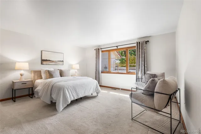 a spacious bathroom with a double vanity sink and a mirror