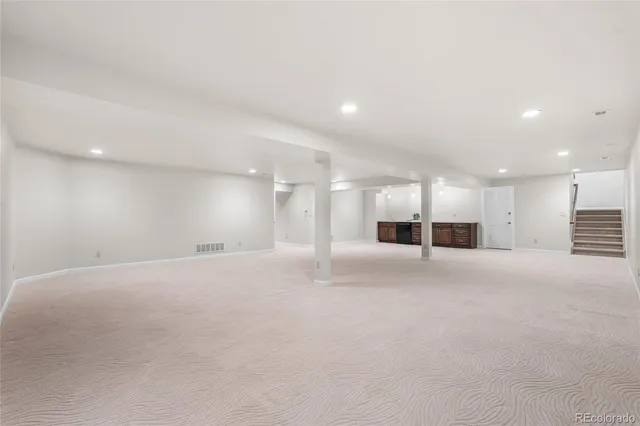 a view of a big room with closet and windows