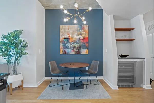 a workspace with furniture and a potted plant