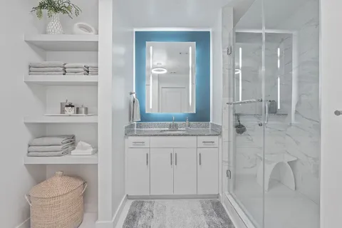 a bathroom with a sink a toilet and vanity