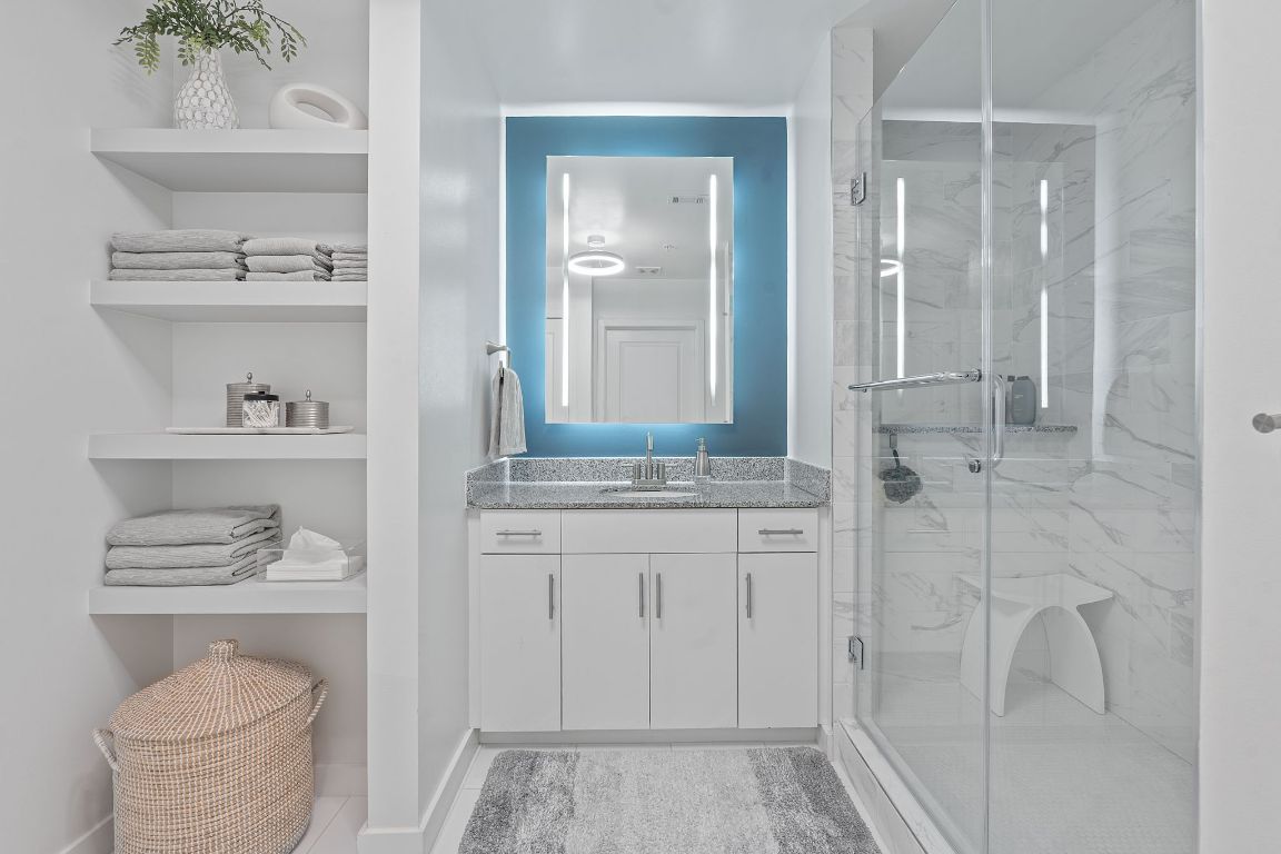 360 Nueces Street, Unit 1007 Austin, TX 78701 - Photo 21 of 40 Full bathroom with vanity and a marble finish shower