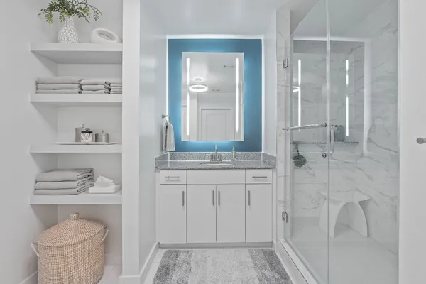 a bathroom with a sink a toilet and vanity