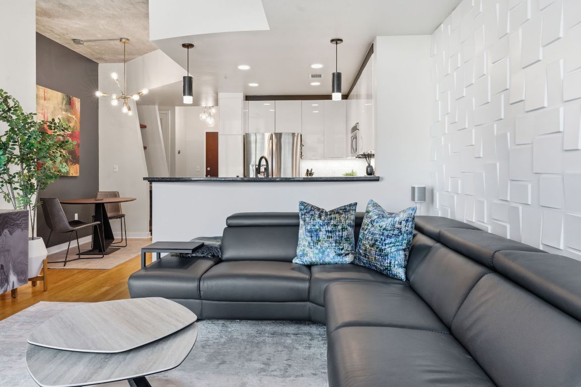 360 Nueces Street, Unit 1007 Austin, TX 78701 - Photo 6 of 40 a living room with furniture and a fireplace