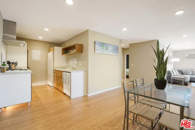 a view of kitchen with furniture and large counter top space
