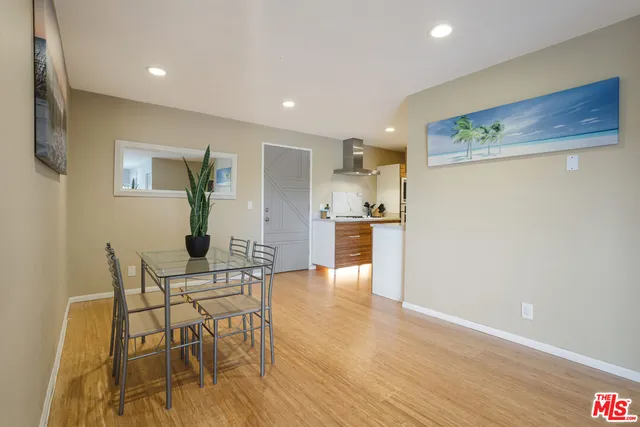 a view of kitchen with cabinets and wooden floor