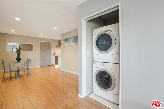 a view of a hallway with washer and dryer