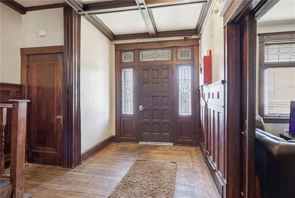 1712 Termon Avenue Pittsburgh, PA 15212 - Photo 11 of 38 a view of a hallway with wooden floor and staircase