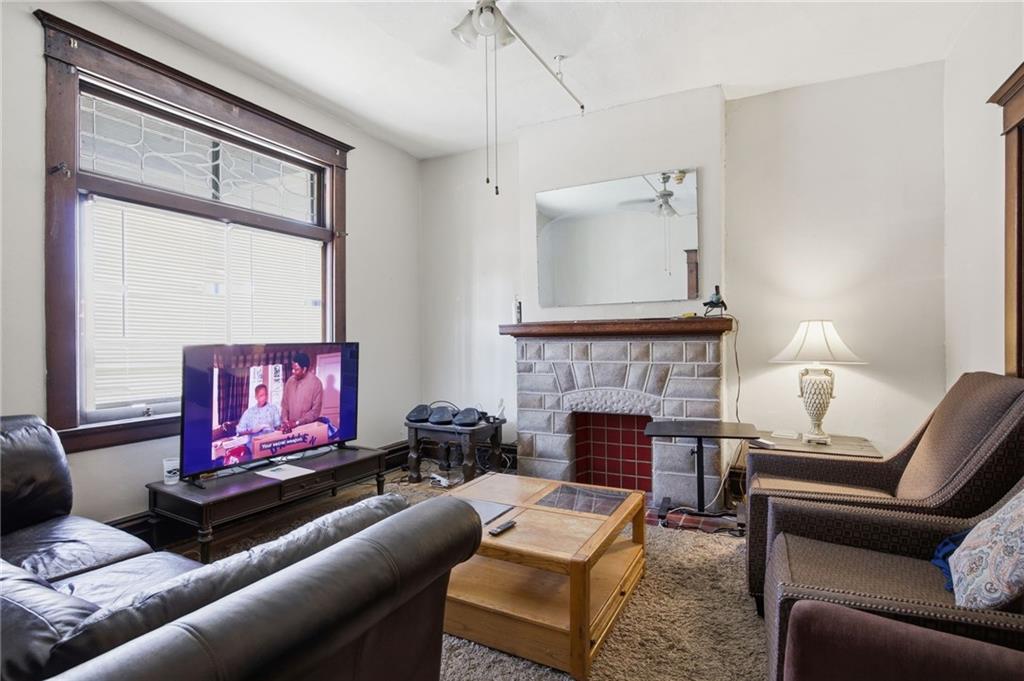 1712 Termon Avenue Pittsburgh, PA 15212 - Photo 14 of 38 a living room with furniture and a fireplace