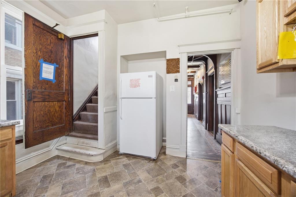 1712 Termon Avenue Pittsburgh, PA 15212 - Photo 17 of 38 a view of a hallway with wooden floor and staircase