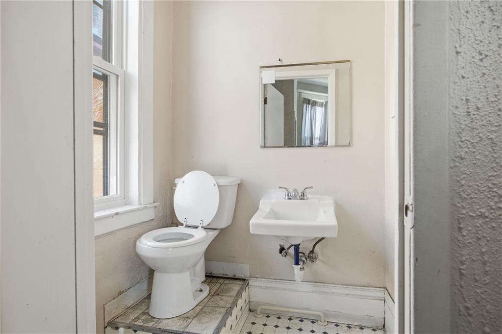 1712 Termon Avenue Pittsburgh, PA 15212 - Photo 19 of 38 a bathroom with a toilet sink and mirror