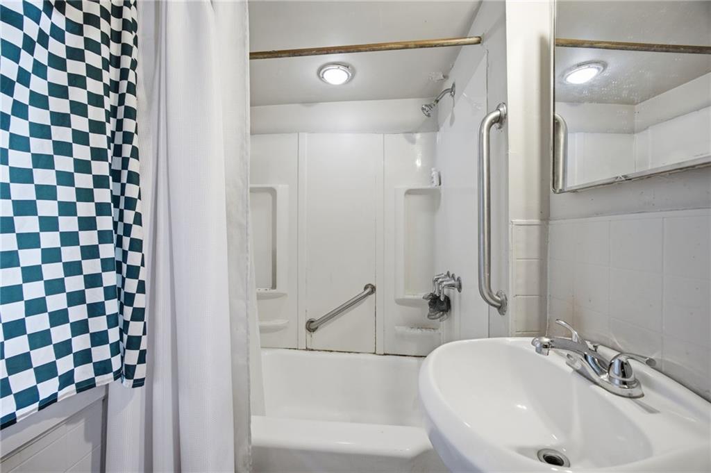 1712 Termon Avenue Pittsburgh, PA 15212 - Photo 20 of 38 a bathroom with a sink and a mirror